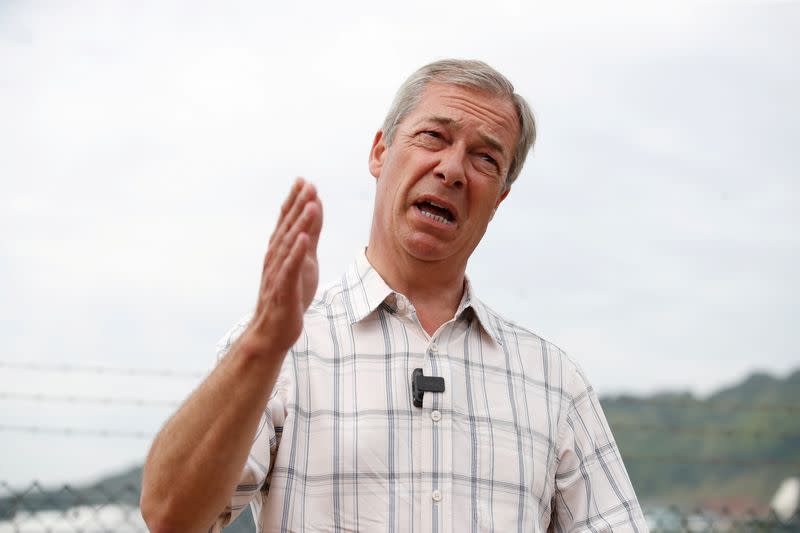 FILE PHOTO: British Brexit Party leader Nigel Farage speaks during a visit at Dover harbour, in Dover