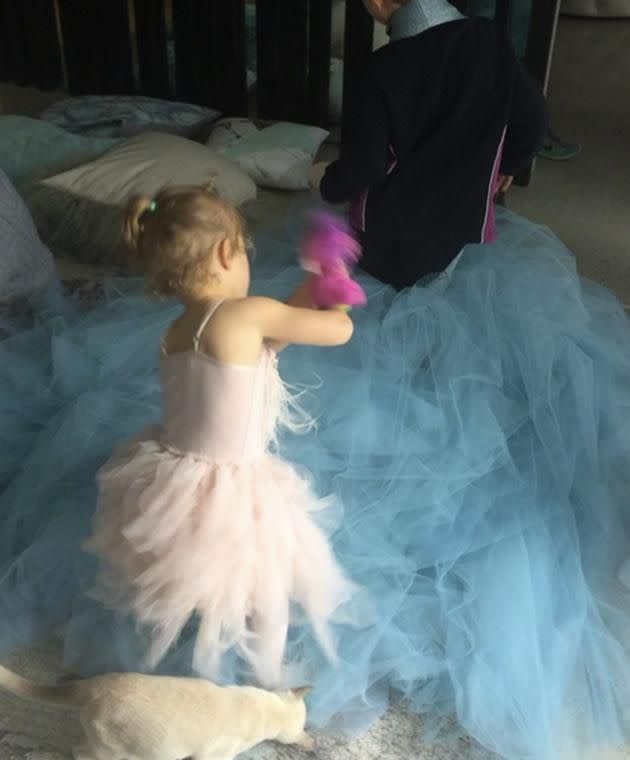 Bec Judd's two children and cat played dress-up with her couture gown.