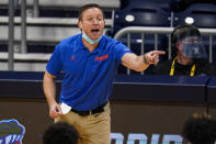 FILE - Florida head coach Mike White gestures in the first half of a first round game against Virginia Tech in the NCAA men's college basketball tournament at Hinkle Fieldhouse in Indianapolis, in this Friday, March 19, 2021, file photo. Florida might have its best defensive team in nearly a decade, an experienced group that seems to fit perfectly with coach Mike White’s style. (AP Photo/Michael Conroy, File)