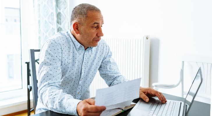 A man calculates how much his Social Security benefits would be if he claimed at age 62 plus his full retirement age. 