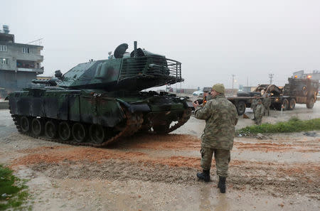 A Turkish military convoy arrives at an army base in the border town of Reyhanli near the Turkish-Syrian border in Hatay province, Turkey January 17, 2018. REUTERS/Osman Orsal