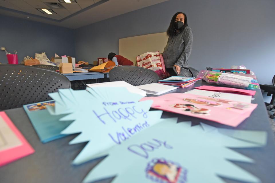 Brigitte Coles, spokeswoman for Richland County Children Services, organizes donations of Valentine's Day cards and gifts Tuesday afternoon.