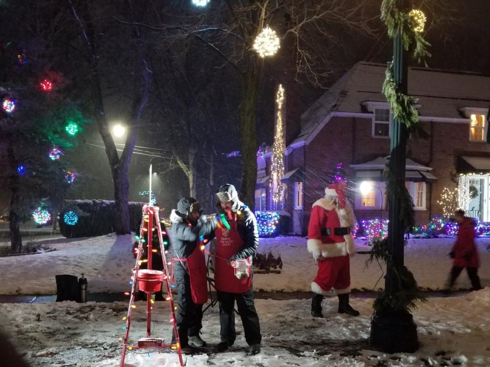 Salvation Army bell ringers and Santa man the red kettle in Sherman Woods in Port Huron