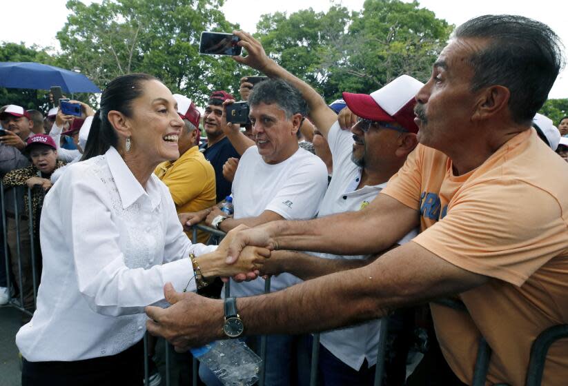 Former Head of Government of Mexico City and presidential pre-candidate for the Morena party, Claudia Sheinbaum, greets supporters during a rally in Guadalajara, Jalisco state, Mexico on July 9, 2023. Just under a year ahead of Mexico's 2024 presidential election, the battle to become the ruling Morena party's candidate is in full swing, with former foreign minister Marcelo Ebrard and ex-Mexico City mayor Claudia Sheinbaum at the fore. The ruling party candidate is expected to be announced on September 6, 2023, based on a public opinion poll, before entering the main stage of the race against the opposition. (Photo by ULISES RUIZ / AFP) (Photo by ULISES RUIZ/AFP via Getty Images)