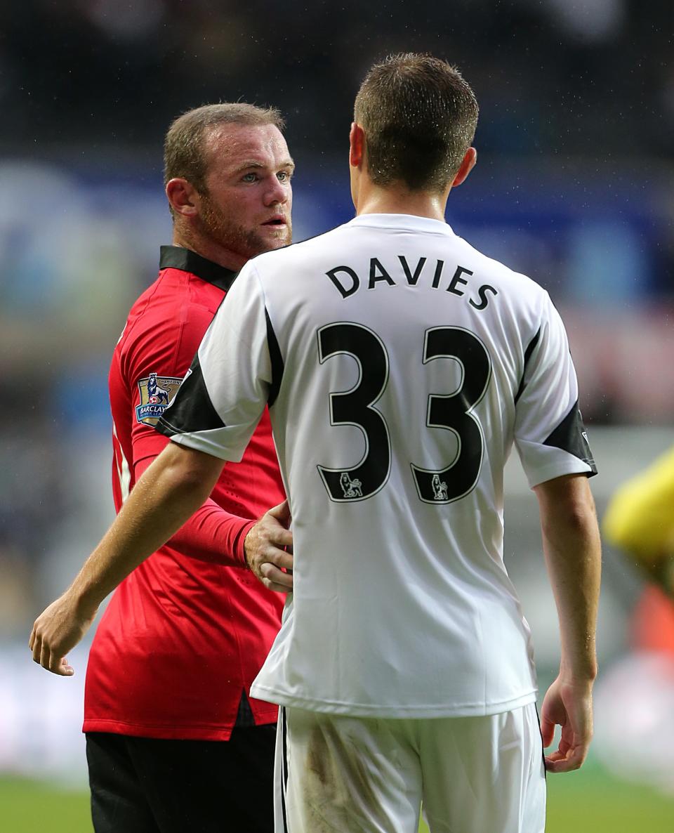 Swansea City's Ben Davies (right) and Manchester United's Wayne Rooney speak after the final whistle.