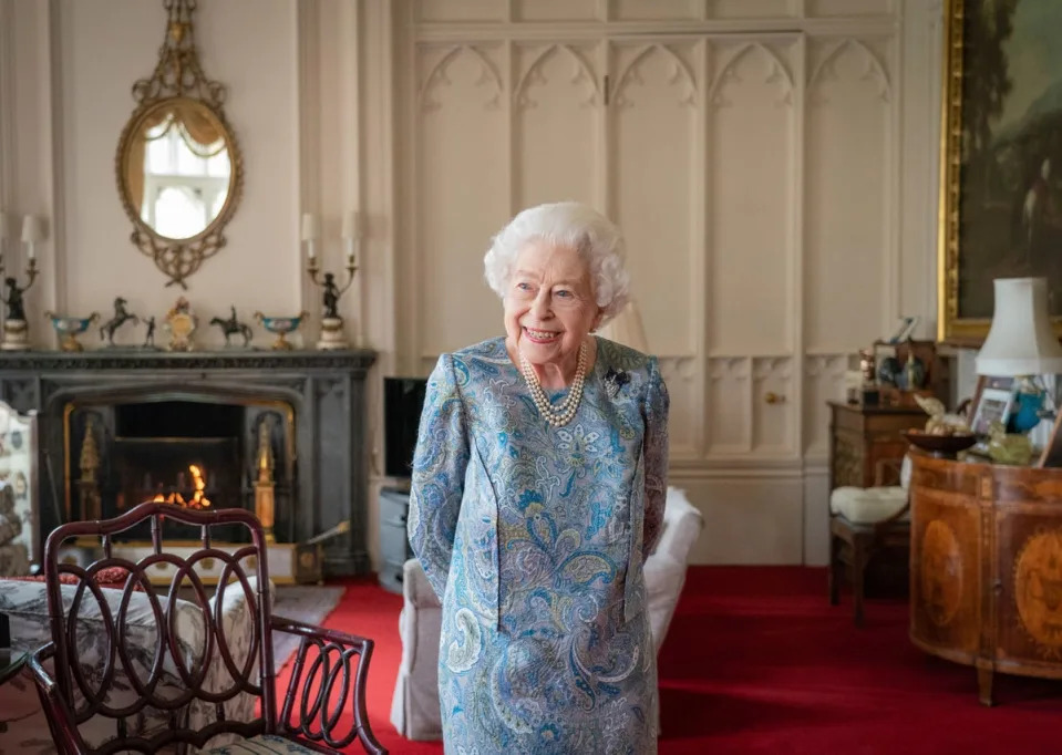 Queen Elizabeth II smiles while receiving the President of Switzerland Ignazio Cassis and his wife Paola Cassis during an audience at Windsor Castle in Windsor, England, Thursday, April 28, 2022. (AP)