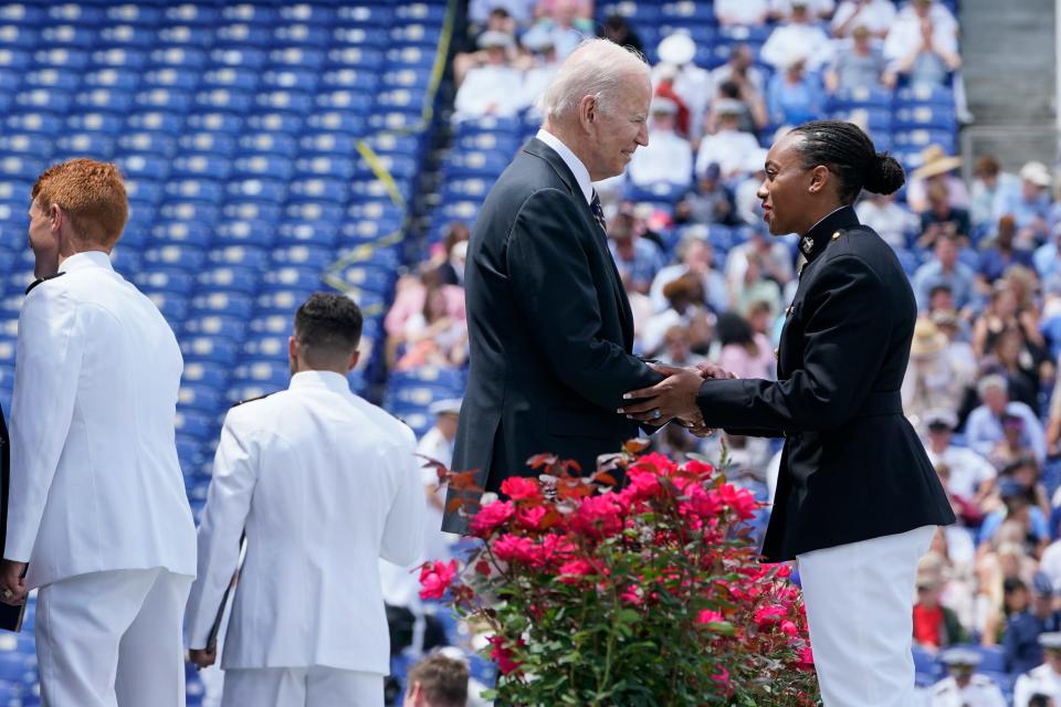 President Joe Biden meets with graduates during the U.S. Naval Academy's graduation and commissioning ceremony at the Navy-Marine Corps Memorial Stadium in Annapolis, Md., on May 27.