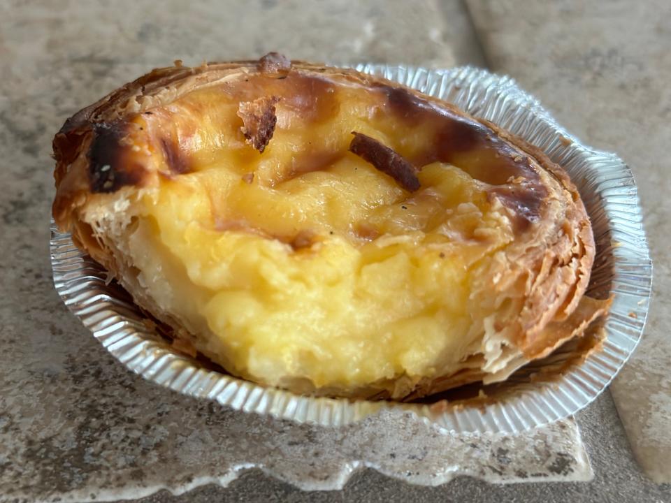 Trader Joe's Portuguese custard tart with a bite taken out of it