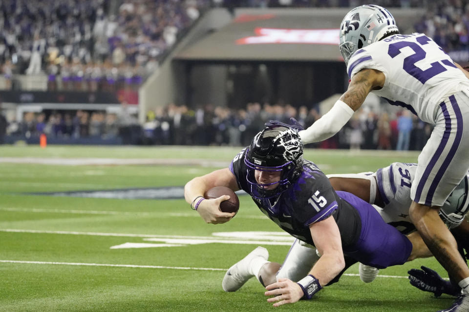 TCU quarterback Max Duggan (15) falls short of a touchdown as Kansas State defensive end Felix Anudike-Uzomah (91) and cornerback Julius Brents (23) make the stop during overtime of the Big 12 Conference championship NCAA college football game, Saturday, Dec. 3, 2022, in Arlington, Texas. (AP Photo/Mat Otero)