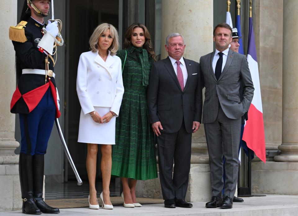 PARIS, FRANCE - JUNE 24 Jordan's King Abdallah II (2ndR) is welcomed by France's President Emmanuel Macron (R) as Jordan's Queen Rania (3rdR) and French first lady Brigitte Macron (C) look at Elysee Palace on June 24, 2024 in Paris, France. (Photo by Christian Liewig - Corbis/Corbis via Getty Images)