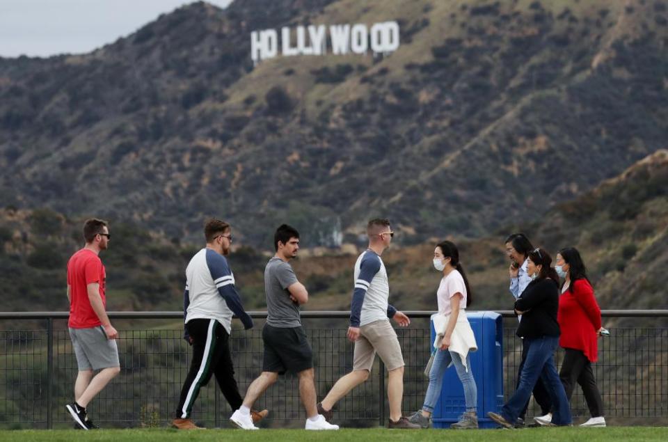 Groups of people walk in Griffith Park in Los Angeles after Governor Gavin Newsom issued a stay-at-home order for all of California.
