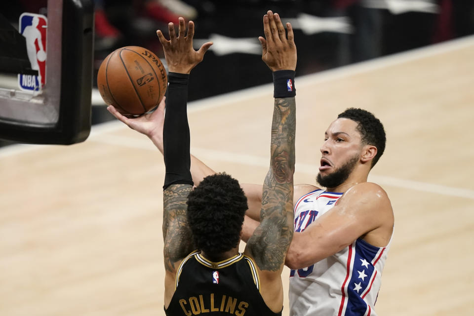 Philadelphia 76ers' Ben Simmons, right, shoots against Atlanta Hawks' John Collins, left, during the first half of Game 4 of a second-round NBA basketball playoff series on Monday, June 14, 2021, in Atlanta. (AP Photo/Brynn Anderson)