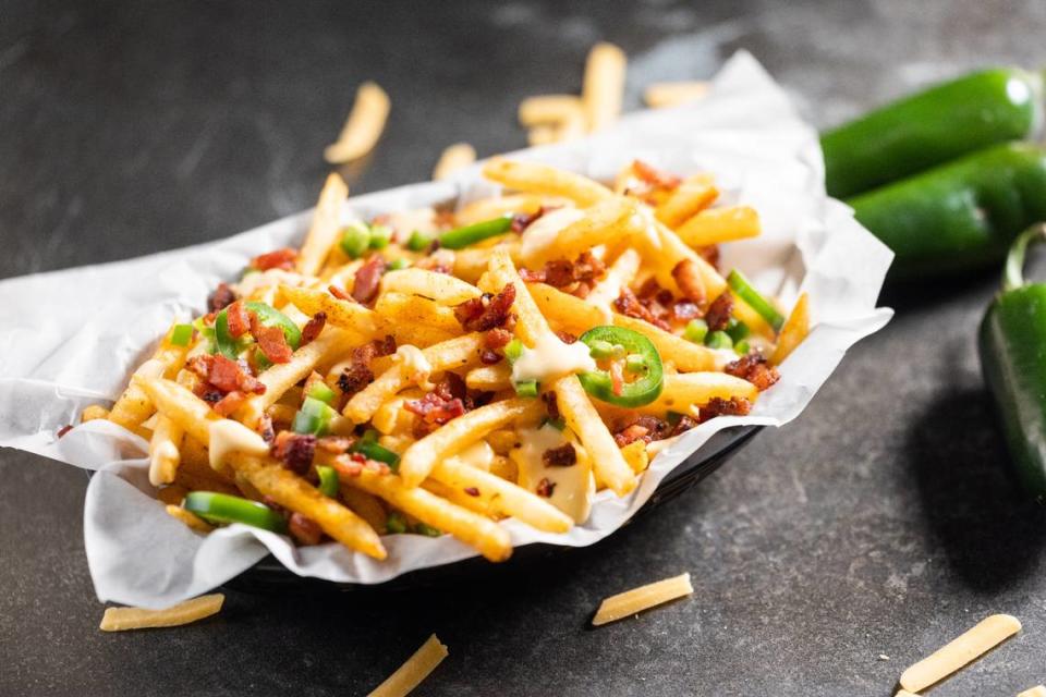 Cinergy offers bacon cheese fries as part of its expansive menu that features chef-prepared burgers, pizza, salads and more.