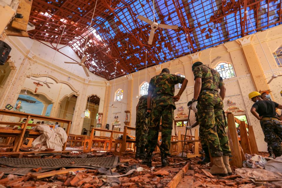 Sri Lankan soldiers inspect the damage inside St. Sebastian's Church where a bomb blast took place in Negombo. Source: Getty Images