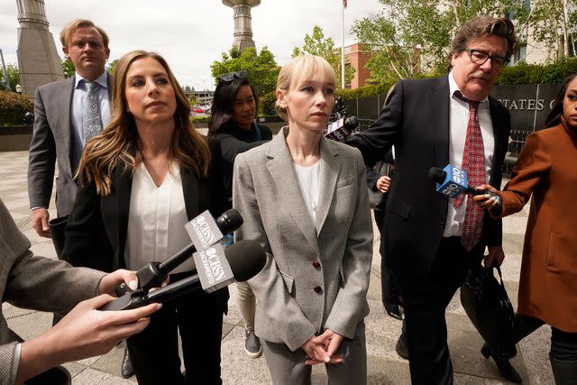 <p>Rich Pedroncelli/AP</p> Sherri Papini walks to the federal courthouse accompanied by her attorney, Willian Portanova on April 13, 2022 in Sacramento, CA..