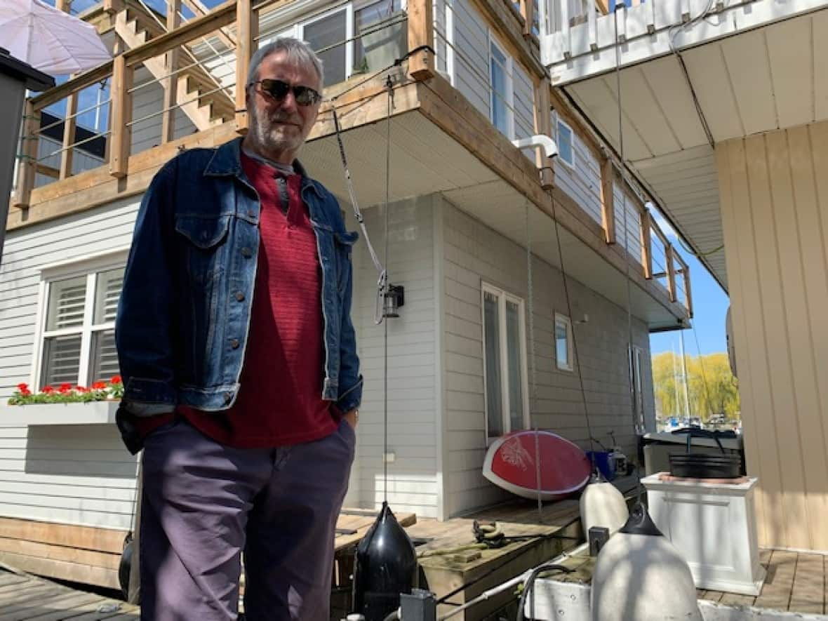 John Whyte and his wife Ingrid Whyte live on one of the two dozen floating homes at Bluffer's Park Marina by the Scarborough Bluffs. (Mike Smee/CBC - image credit)