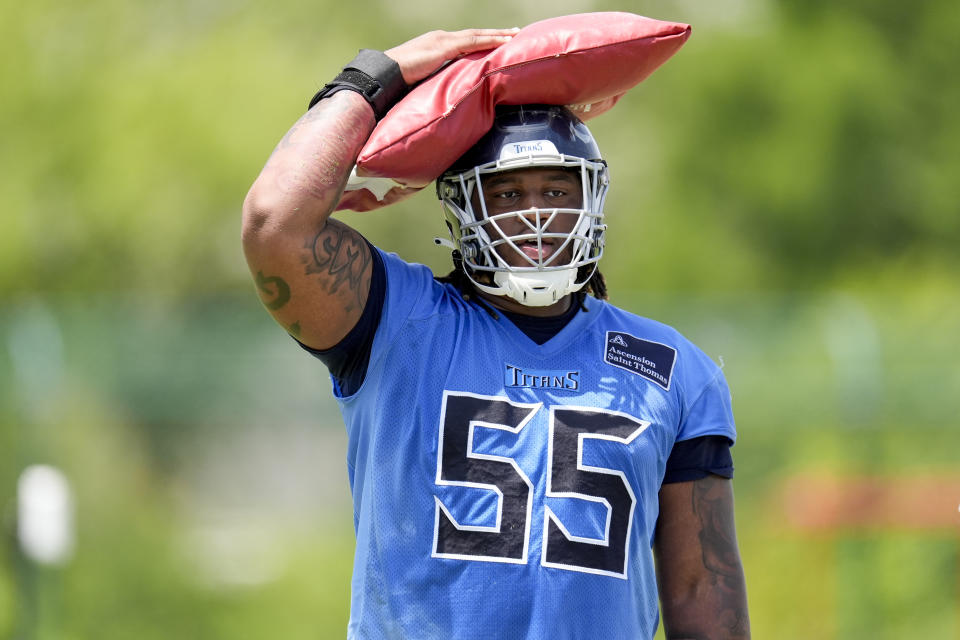 Tennessee Titans tackle JC Latham (55) holds a sand bag on his head during NFL football practice Wednesday, May 29, 2024, in Nashville, Tenn. (AP Photo/George Walker IV)