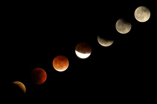 This combination of pictures shows the moon in various stages of a total lunar eclipse. (Photo: AP Photo/Ringo H.W. Chiu)