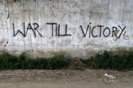 Graffiti is sprayed on a wall in Srinagar, Kashmir, India May 20, 2017. REUTERS/Cathal McNaughton