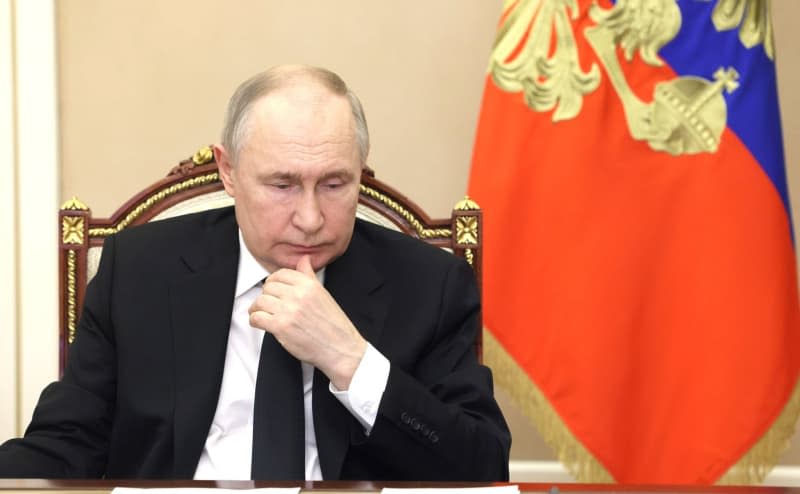 Russian President Vladimir Putin attends a video conference with the heads of the government, regions, special services and law enforcement agencies on measures taken after the terrorist attack at the Crocus City Hall concert complex. -/Kremlin/dpa
