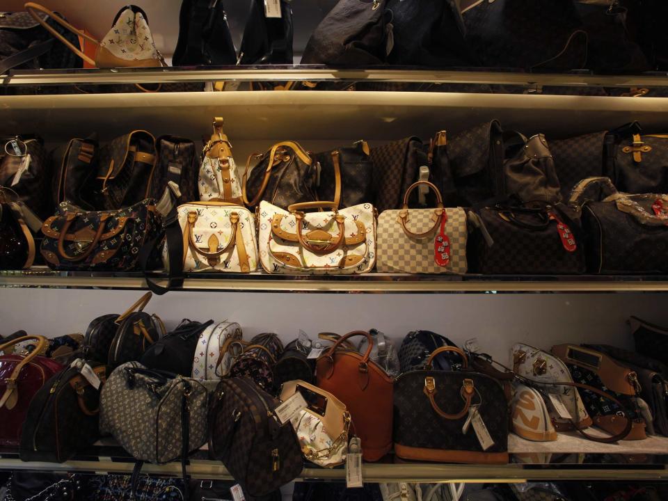 Second-hand luxury handbags are displayed at a Milan Station outlet in Hong Kong.