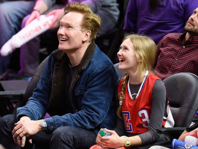 <p>Noel Vasquez/GC Images</p> Conan O'Brien and Neve O'Brien attend a basketball game between the Houston Rockets and the Los Angeles Clippers on January 18, 2016 in Los Angeles, California.