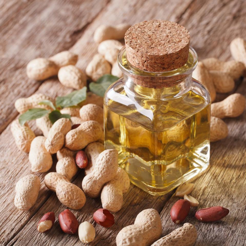 <p>A high-heat cooking oil, peanut oil is made from the seeds of a peanut plant. Most are refined, which is the common type of peanut oil. It’s <strong>budget-friendly and has a neutral flavor, making it a versatile option for many dishes.</strong> Unrefined options do exist and are made by drying the peanuts at a low temperature and extracting the oil, which helps preserve most of its nutrients. Unrefined or cold-pressed peanut oil has a strong, nutty flavor and aroma which compliments salads and spreads very well. </p><p>According to dietitian <a href="https://go.redirectingat.com?id=74968X1596630&url=https%3A%2F%2Fwww.linkedin.com%2Fin%2Fjadalinton%2F&sref=https%3A%2F%2Fwww.goodhousekeeping.com%2Fhealth%2Fdiet-nutrition%2Fg32108013%2Fhealthiest-cooking-oils%2F" rel="nofollow noopener" target="_blank" data-ylk="slk:Jada Linton, RDN, LD;elm:context_link;itc:0;sec:content-canvas" class="link ">Jada Linton, RDN, LD</a>, there are a few different types of peanut oil, each made using a different technique and offering a range of flavors from mild and sweet to strong and nutty. Almost half of peanut oil is monounsaturated fats. Traditionally used in Asian dishes, peanut oil has a relatively high smoke point and is ideal for searing meats, <a href="https://www.goodhousekeeping.com/food-recipes/cooking/a36109179/grilling-for-beginners/" rel="nofollow noopener" target="_blank" data-ylk="slk:grilling;elm:context_link;itc:0;sec:content-canvas" class="link ">grilling</a>, roasting vegetables and frying. "On top of the delicious flavor, peanut oil is a great source of vitamin E containing 11% of the recommended daily intake and has one of the highest monounsaturated fat contents among cooking oils,” Linton adds.<br></p><p><strong>Best for: </strong>Stir fry and sautéing </p><p><strong>Smoke point:</strong> 450°F</p><p><strong>Nutritionist pick:</strong> <a href="https://www.amazon.com/Spectrum-Unrefined-Peanut-Oil-16/dp/B004SI17FC/?tag=syn-yahoo-20&ascsubtag=%5Bartid%7C10055.g.32108013%5Bsrc%7Cyahoo-us" rel="nofollow noopener" target="_blank" data-ylk="slk:Spectrum Unrefined Peanut Oil;elm:context_link;itc:0;sec:content-canvas" class="link ">Spectrum Unrefined Peanut Oil</a><br></p>