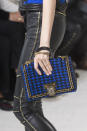<p><i>Blue and black tweed gold chain handbag from the SS18 Balmain collection. (Photo: ImaxTree) </i></p>