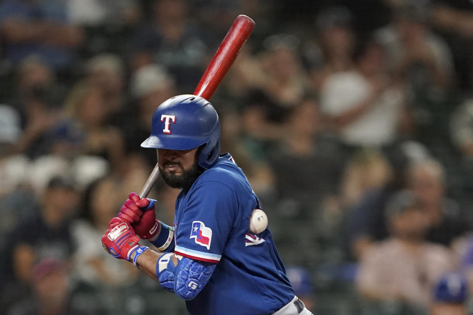 Texas Rangers' Isiah Kiner-Falefa is hit by a pitch during the eighth inning of the team's baseball game against the Seattle Mariners, Wednesday, Aug. 11, 2021, in Seattle. (AP Photo/Ted S. Warren)