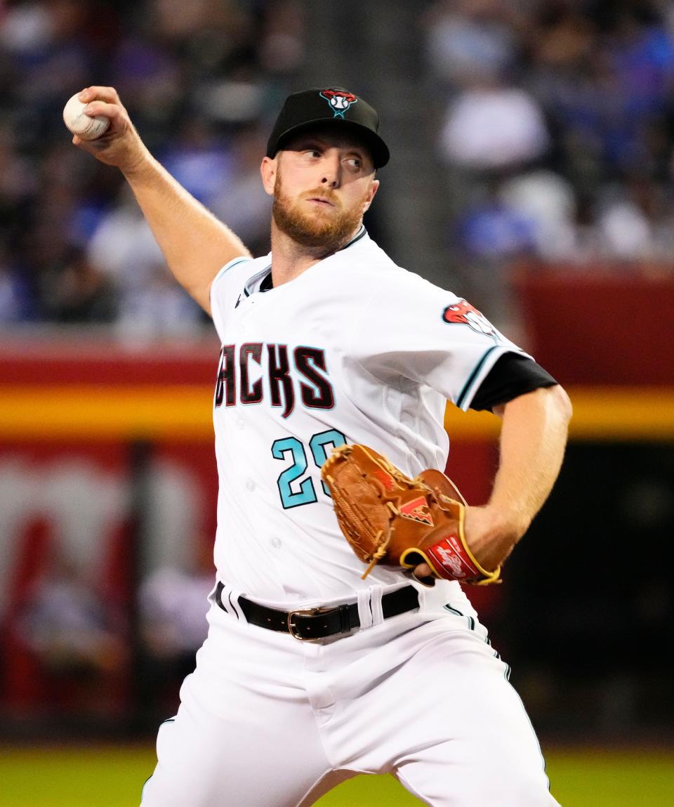 Sep 13, 2022; Phoenix, Arizona, USA; Arizona Diamondbacks starting pitcher Merrill Kelly (29) throws to the Los Angeles Dodgers in the first inning at Chase Field.