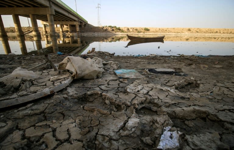 A picture taken on March 20, 2018 shows a view of the dried-up shore of an irrigation canal near the village of Sayyed Dakhil, south of Baghdad