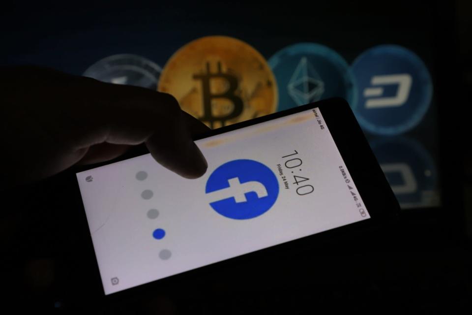 Cryptocurrency and Facebook Logo are seen together in this photo illustration. (Photo by Nasir Kachroo/NurPhoto via Getty Images)