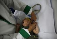 Five-month-old Laura gets her head measured by the neurologist, Maria Leal Santos, at the Casa da Esperanca Hospital (Hope House Hospital) in Santos, Sao Paulo state, Brazil April 20, 2016. REUTERS/Nacho Doce