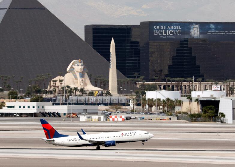 A Boeing 737 (737-800), belonging to Delta Airlines, passes the Luxor Hotel/Casino as it takes off at McCarran International Airport in Las Vegas, Nevada on Mar. 3, 2016. (Larry MacDougal via AP)