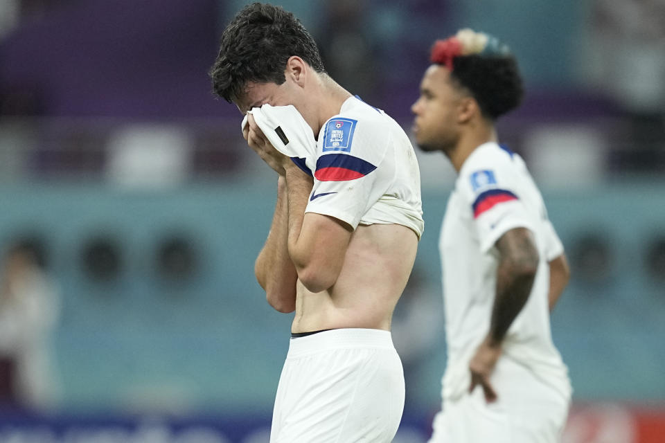 Gio Reyna of the United States, center, is dejected after the World Cup round of 16 soccer match between the Netherlands and the United States, at the Khalifa International Stadium in Doha, Qatar, Saturday, Dec. 3, 2022. Netherlands won 3-1. (AP Photo/Ebrahim Noroozi)