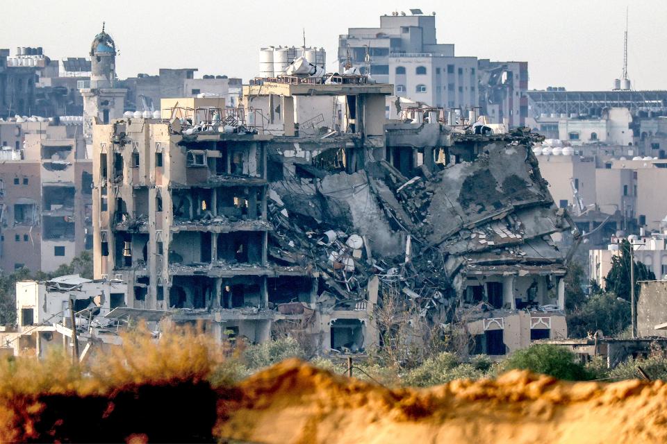 This picture taken on Jan. 3, 2024, shows a view of a buildings destroyed by Israeli bombardment in the central Gaza Strip from a position across the border in southern Israel amid the ongoing conflict between Israel and the Palestinian militant group Hamas.