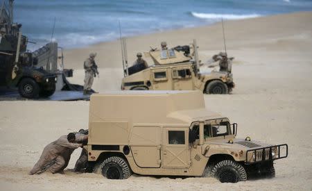 NATO soldiers attend a NATO military exercise at Raposa beach, near Setubal, Portugal October 20, 2015. REUTERS/Rafael Marchante