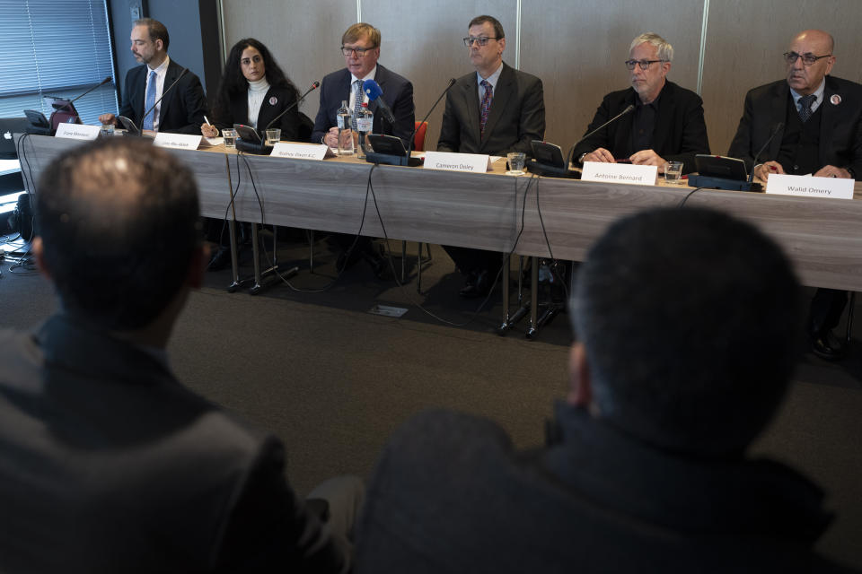 Rodney Dixon, lawyer for Al Jazeera, third from left, and Lina Abu Akleh, niece of fatally shot Al Jazeera journalist Shireen Abu Akleh, right, second left, answer questions during a press conference after presenting a letter requesting a formal investigation into the killing to the International Criminal Court in The Hague, Netherlands, Tuesday, Dec. 6, 2022. Palestinian officials, Abu Akleh's family and Al Jazeera accuse Israel of intentionally targeting and killing the 51-year-old journalist, a claim Israel denies. (AP Photo/Peter Dejong)