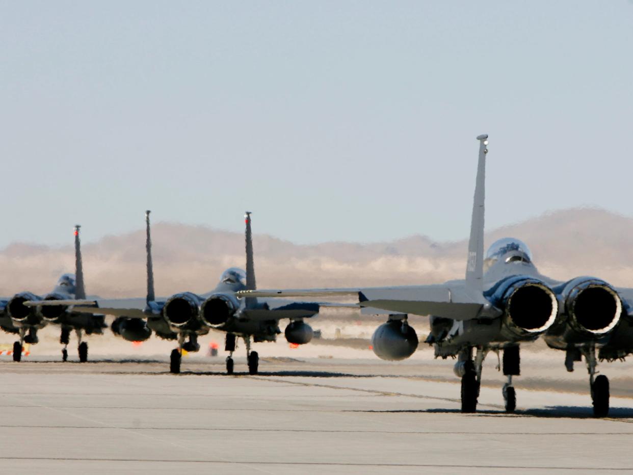 Aircraft prepare for takeoff during a Red Flag exercise with the US Air Force at Nellis Air Force base in Las Vegas on Monday, August 11, 2008.