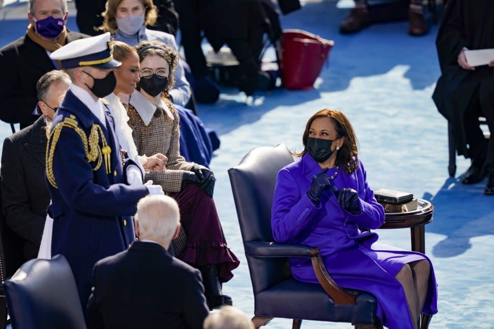 Newly sworn in Vice President Kamala Harris looks back at Jennifer Lopez during the inauguration of U.S. President-elect Joe Biden on the West Front of the U.S. Capitol on January 20, 2021 in Washington, DC. During today's inauguration ceremony Joe Biden becomes the 46th president of the United States