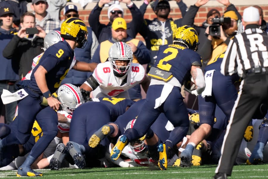 Michigan running back Blake Corum (2) rushes for a touchdown during the first half of an NCAA college football game against Ohio State, Saturday, Nov. 25, 2023, in Ann Arbor, Mich. (AP Photo/Carlos Osorio)