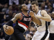 Portland Trail Blazers' LaMarcus Aldridge, left, is pressured by San Antonio Spurs' Tiago Splitter, of Brazil, during the first half of Game 1 of a Western Conference semifinal NBA basketball playoff series, Tuesday, May 6, 2014, in San Antonio. (AP Photo/Eric Gay)