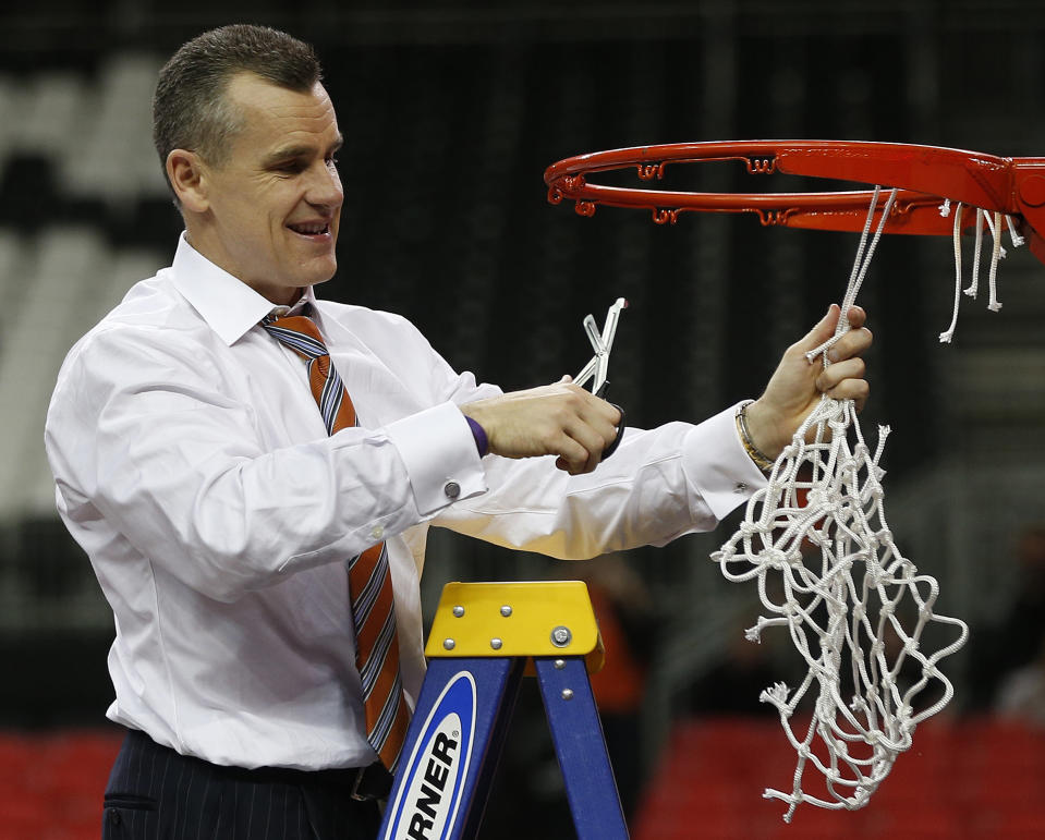 Florida head coach Billy Donovan takes the net after the second half of an NCAA college basketball game against Kentucky in the Championship round of the Southeastern Conference men's tournament, Sunday, March 16, 2014, in Atlanta. Florida won 61-60. (AP Photo/John Bazemore)