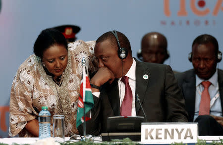 Kenya's President Uhuru Kenyatta talks to Kenya's Foreign Affairs Cabinet Secretary Amina Mohamed during the Sixth Tokyo International Conference on African Development (TICAD VI) in Kenya's capital Nairobi, August 27, 2016. REUTERS/Thomas Mukoya