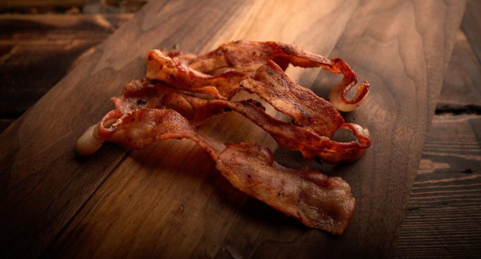crispy bacon on a wooden board