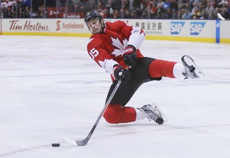 Sep 27, 2016; Toronto, Ontario, Canada; Team Canada center Ryan Getzlaf (15) falls as he plays the puck against Team Europe during the third period in game one of the World Cup of Hockey final at Air Canada Centre. Mandatory Credit: John E. Sokolowski-USA TODAY Sports