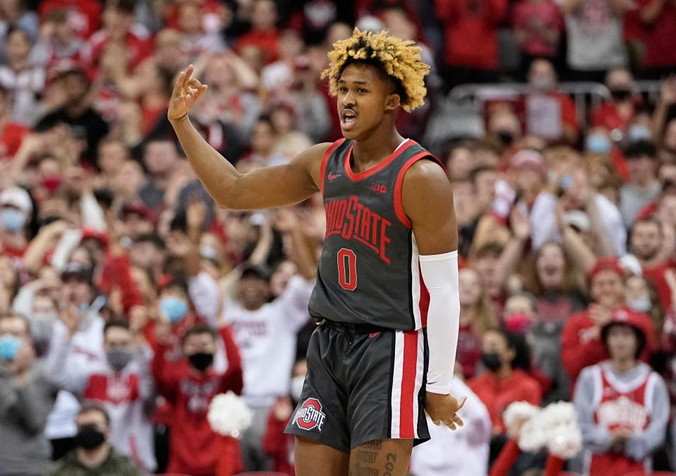 Ohio State Buckeyes guard Meechie Johnson Jr. (0) celebrates a three pointer during the second half of the NCAA men's basketball game against the Wisconsin Badgers at Value City Arena in Columbus on Saturday, Dec. 11, 2021.