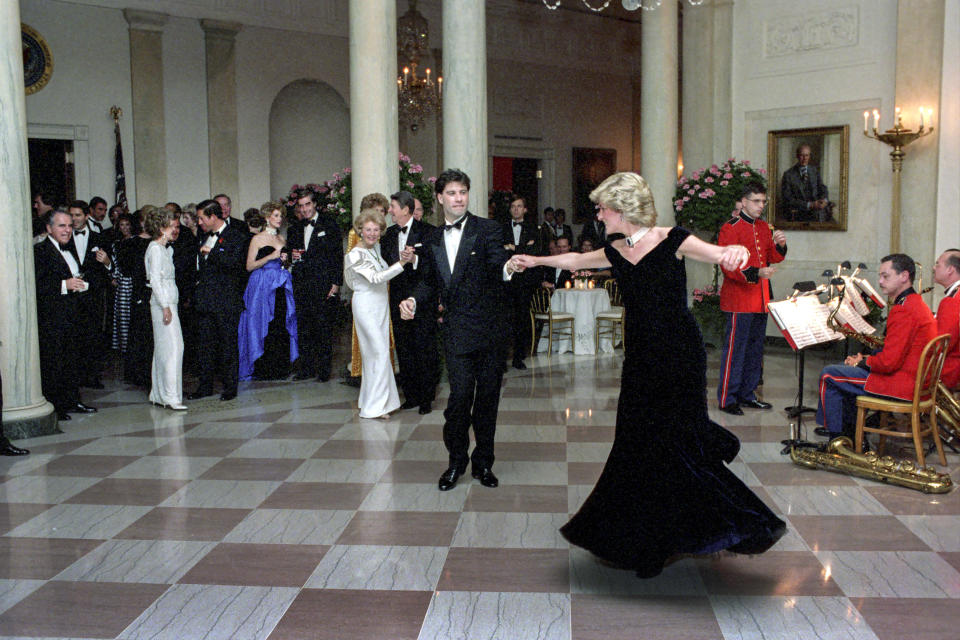 WASHINGTON, DC - NOVEMBER 9, 1985: In this handout image provided by The White House, Princess Diana dances with John Travolta in Cross Hall at the White House during an official dinner on November 9, 1985 in Washington, DC. (Photo by Pete Souza/The White House via Getty Images)