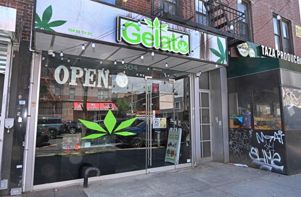 The vehicle had the same marijuana logo emblazoned on its side as the padlocked storefront. Gregory P. Mango