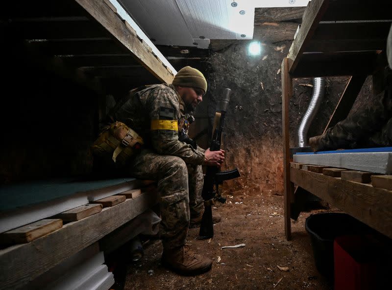 FILE PHOTO: A serviceman rests in a dugout at his position on a front line in Zaporizhzhia region